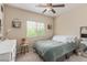 The bedroom features a ceiling fan and a window for natural light at 6788 Sharks Bay Ct, Las Vegas, NV 89149