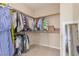 This walk-in closet offers ample storage with multiple rods and shelving at 6788 Sharks Bay Ct, Las Vegas, NV 89149