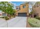 Charming two-story home with a large two car garage, long driveway and manicured landscaping at 6788 Sharks Bay Ct, Las Vegas, NV 89149
