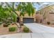 Home exterior showing the driveway, garage, landscaping, and facade at 6788 Sharks Bay Ct, Las Vegas, NV 89149