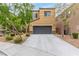 Charming two-story home with a well-maintained front yard and long driveway leading to the attached garage at 6788 Sharks Bay Ct, Las Vegas, NV 89149