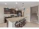 Well-designed kitchen with granite counters, an island with seating, and stainless steel appliances at 6788 Sharks Bay Ct, Las Vegas, NV 89149