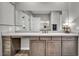 Bathroom featuring a large mirror, marble countertop, and stylish cabinetry at 6865 Steel Mist St, Las Vegas, NV 89148