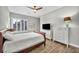 Comfortable bedroom featuring a ceiling fan, white dresser, and tiled flooring at 6865 Steel Mist St, Las Vegas, NV 89148