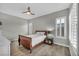 Cozy bedroom with a ceiling fan, stylish shuttered windows, and neutral decor for a peaceful retreat at 6865 Steel Mist St, Las Vegas, NV 89148