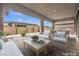 Inviting covered patio with pavers, neutral furniture, and a dining area, great for outdoor entertaining at 6865 Steel Mist St, Las Vegas, NV 89148