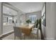 Bright dining room with modern table, chairs, and large window at 6865 Steel Mist St, Las Vegas, NV 89148