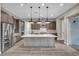 Sleek kitchen design with stainless steel appliances and a spacious central island at 6865 Steel Mist St, Las Vegas, NV 89148
