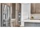 Modern kitchen features stainless appliances, double ovens and sleek stylish cabinets at 6865 Steel Mist St, Las Vegas, NV 89148