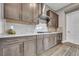 Contemporary kitchen with modern appliances, sleek cabinetry, and white marble backsplash at 6865 Steel Mist St, Las Vegas, NV 89148