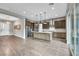 Modern kitchen boasts an island with seating, stainless steel appliances, and ample counter space at 6865 Steel Mist St, Las Vegas, NV 89148