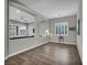 Living room with tiled flooring, partial wall, and natural light at 6865 Steel Mist St, Las Vegas, NV 89148