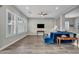 Open concept living room with tile flooring and abundant natural light at 6865 Steel Mist St, Las Vegas, NV 89148