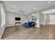 Spacious living room with neutral tones, tile flooring, and an open layout at 6865 Steel Mist St, Las Vegas, NV 89148