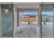 The home features a beautiful outdoor patio with brick flooring and sliding glass doors at 6865 Steel Mist St, Las Vegas, NV 89148