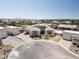 An aerial view of the house shows a circular driveway and detached garage at 7062 Maverick St, Las Vegas, NV 89131