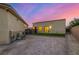 The house's rear exterior has a gravel yard with a small strip of artificial turf at 7062 Maverick St, Las Vegas, NV 89131
