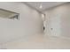 Spacious bedroom features tile flooring, a window, neutral paint, and base molding at 7062 Maverick St, Las Vegas, NV 89131