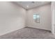 Neutral bedroom with carpet, window, recessed lighting, and neutral walls and trim at 7062 Maverick St, Las Vegas, NV 89131