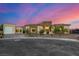 Stunning single-story home showcasing modern architecture with a stone facade and a circular driveway at 7062 Maverick St, Las Vegas, NV 89131
