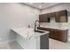 Kitchen island with a modern faucet and stylish countertop, complemented by sleek cabinetry at 7062 Maverick St, Las Vegas, NV 89131