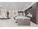 Open concept kitchen and dining area with a large island, stainless steel appliances, and modern lighting at 7062 Maverick St, Las Vegas, NV 89131