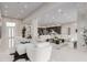Spacious living area with modern decor, featuring sleek tile floors and recessed lighting throughout at 7062 Maverick St, Las Vegas, NV 89131