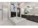 Luxurious main bathroom featuring a soaking tub, fireplace, double vanity, and modern fixtures at 7062 Maverick St, Las Vegas, NV 89131
