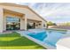 Backyard pool and jacuzzi with well-manicured artificial turf, perfect for outdoor relaxation at 7062 Maverick St, Las Vegas, NV 89131