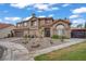 Elegant two-story home with a tile roof, desert landscaping, and a two-car garage at 7621 Hackensack Ct, Las Vegas, NV 89128