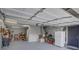Well-lit garage with updated lighting fixtures providing ample space for vehicles and storage at 7621 Hackensack Ct, Las Vegas, NV 89128
