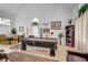 Open-concept living room with a pool table, high ceilings, and plenty of natural light at 7621 Hackensack Ct, Las Vegas, NV 89128