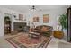 Cozy living room with a brick fireplace and traditional furnishings at 7621 Hackensack Ct, Las Vegas, NV 89128
