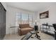 Home office space features a cozy sofa, exercise bench, and a 'Welcome to Las Vegas' sign at 7621 Hackensack Ct, Las Vegas, NV 89128