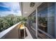 Serene balcony with city views, sliding glass doors, and potted greenery for a peaceful retreat at 794 Oakmont Ave # 106, Las Vegas, NV 89109