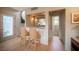 Convenient bar area featuring two bar stools, granite countertops, and doorway at 794 Oakmont Ave # 106, Las Vegas, NV 89109