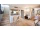 Open dining area adjacent to bar with hardwood floors and contemporary lighting, ideal for entertaining guests at 794 Oakmont Ave # 106, Las Vegas, NV 89109