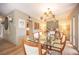 Elegant dining area with contemporary lighting, light wood floors, and neutral wall color at 794 Oakmont Ave # 106, Las Vegas, NV 89109