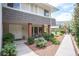 Charming front entrance with double doors, brick accents, and lush landscaping for a welcoming appeal at 794 Oakmont Ave # 106, Las Vegas, NV 89109