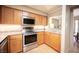 The kitchen includes stainless steel appliances, granite countertops, and light wood cabinetry at 794 Oakmont Ave # 106, Las Vegas, NV 89109