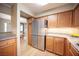 Well-lit kitchen featuring stainless steel refrigerator and light wood cabinets with granite countertops at 794 Oakmont Ave # 106, Las Vegas, NV 89109