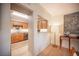 Open kitchen features light wood cabinetry, granite counters, and stainless steel appliances at 794 Oakmont Ave # 106, Las Vegas, NV 89109