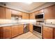 Kitchen showcasing granite countertops, stainless steel appliances, and light wood cabinets at 794 Oakmont Ave # 106, Las Vegas, NV 89109