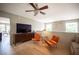 Bright living room with neutral decor, light hardwood floors, and ceiling fan at 794 Oakmont Ave # 106, Las Vegas, NV 89109