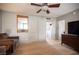 Spacious living room featuring light hardwood floors and a built in laundry area at 794 Oakmont Ave # 106, Las Vegas, NV 89109