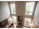High-angle view of a living room with a stone fireplace and comfortable seating at 794 Oakmont Ave # 106, Las Vegas, NV 89109