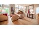Cozy living room with stone fireplace, grand piano, and comfortable seating area at 794 Oakmont Ave # 106, Las Vegas, NV 89109