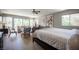 Open main bedroom with light wood floors, windows, and outdoor views at 794 Oakmont Ave # 106, Las Vegas, NV 89109