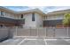 Exterior view with parking spaces and gated area, offering convenient parking and a private feel at 794 Oakmont Ave # 106, Las Vegas, NV 89109