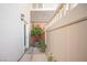 Cozy side yard with flowers in pots, access door, and nice brick and siding accents at 794 Oakmont Ave # 106, Las Vegas, NV 89109